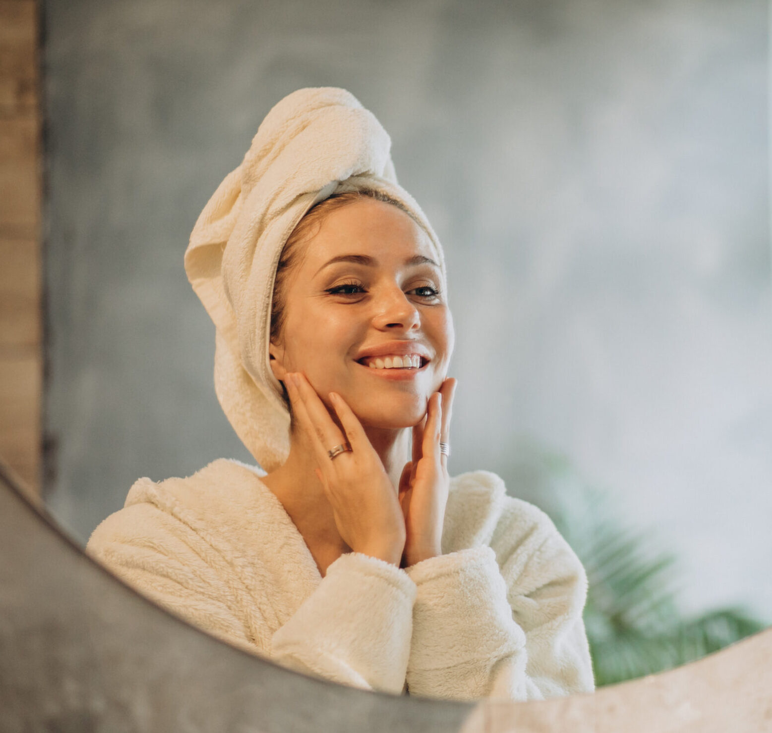 Woman at home applying cream mask